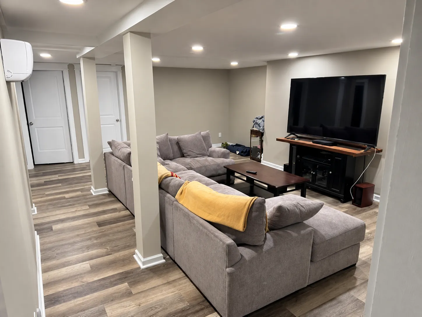 Family room with sectional and large TV