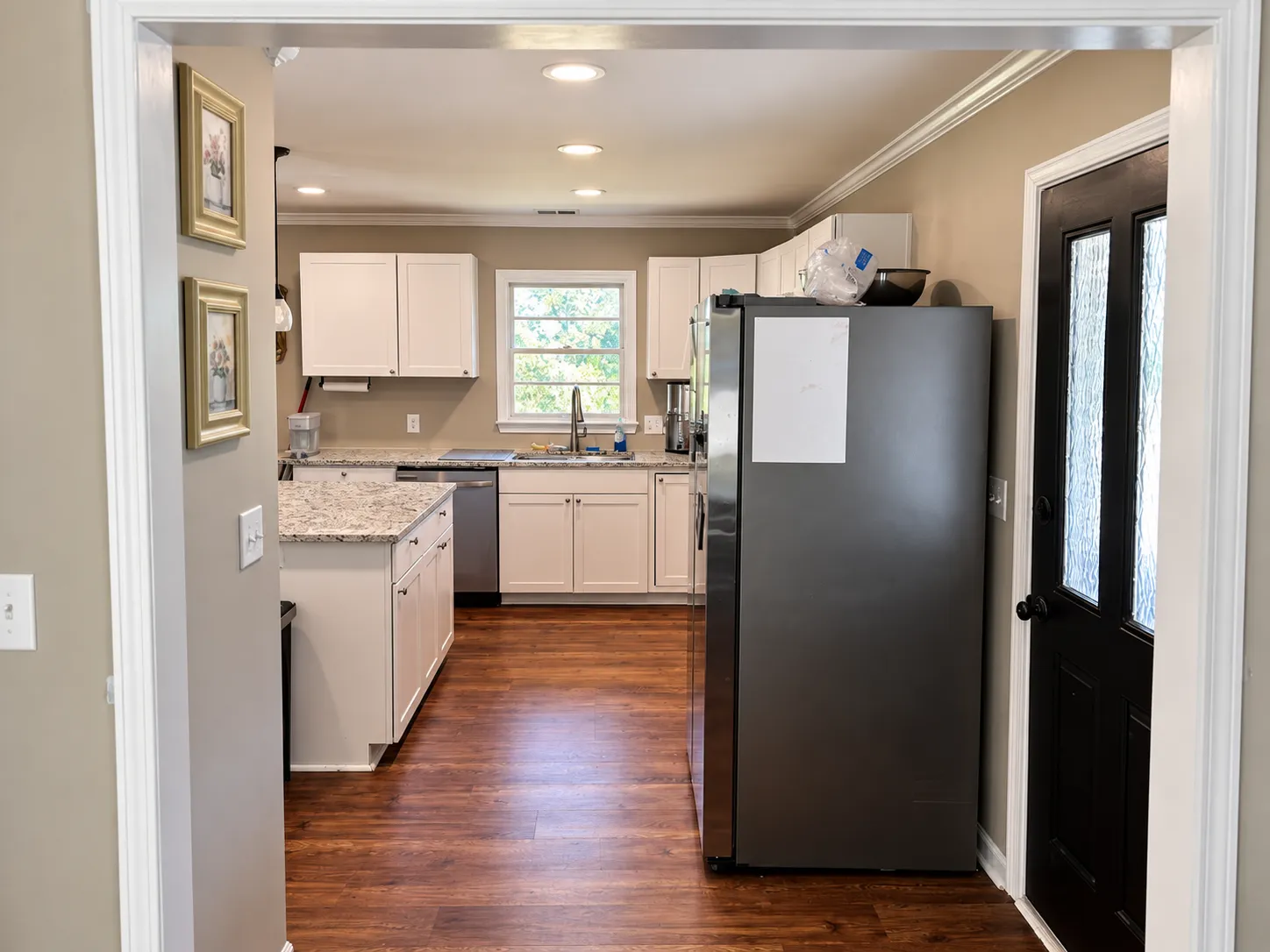 Kitchen and two full-size fridges