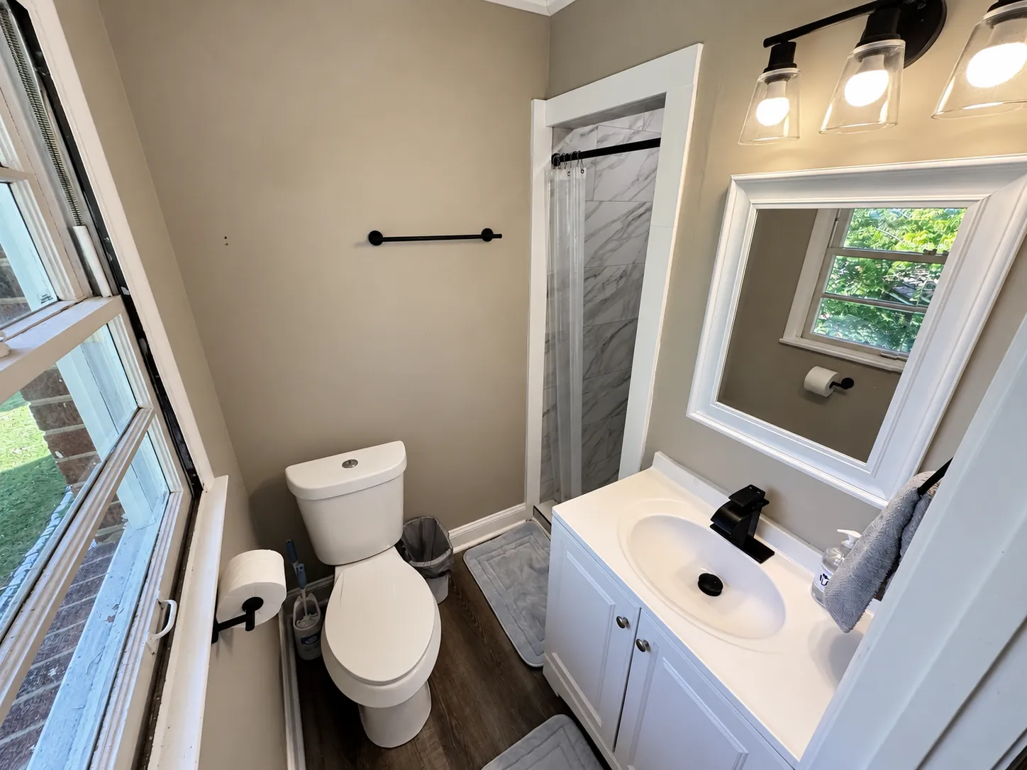 Private suite bathroom with tiled shower